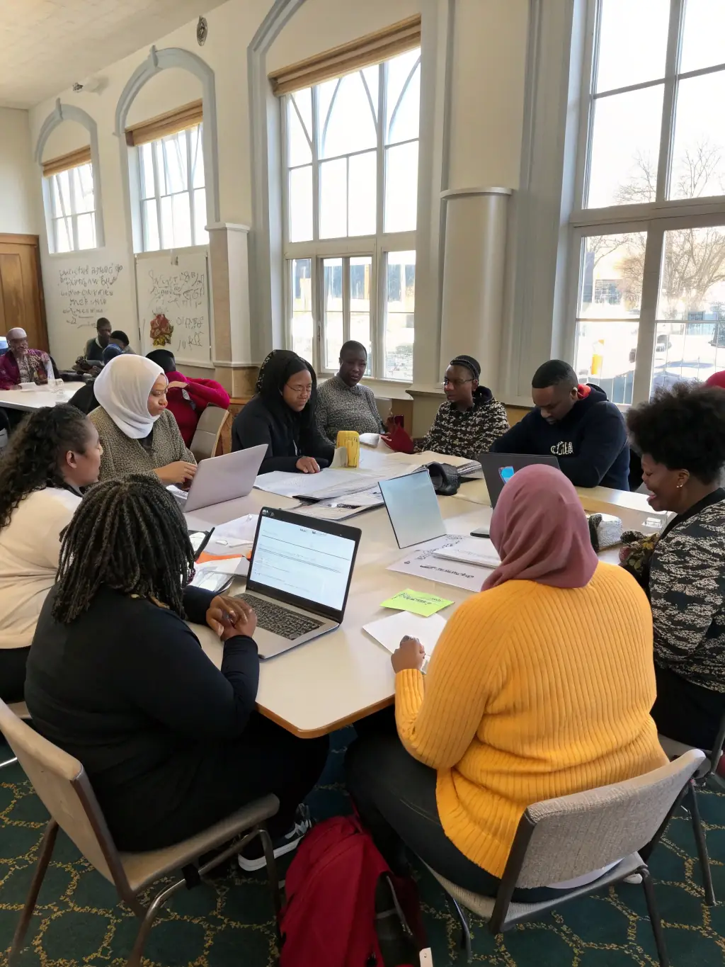 A workshop session with participants actively engaged in discussions and activities related to human rights education, reflecting LDH's focus on empowerment.